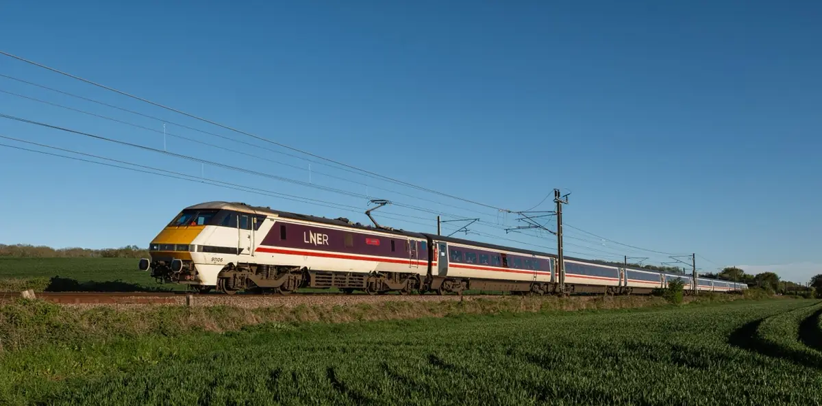 A passenger train travelling through countryside